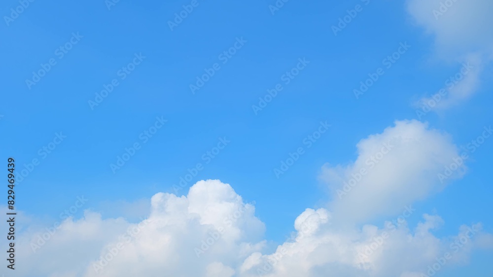 A bright blue sky with large, fluffy white clouds. The clouds have a soft, billowy appearance, creating a striking contrast against the clear blue background. The scene is calm and refreshing.
A bright blue sky with large, fluffy white clouds. The clouds have a soft, billowy appearance, creating a striking contrast against the clear blue background. The scene is calm and refreshing.
