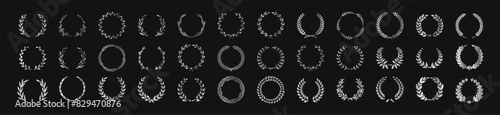 Circular silver laurel foliate vector icon set. Set of black silhouette circular laurel foliate, wheat and oak wreaths depicting an award