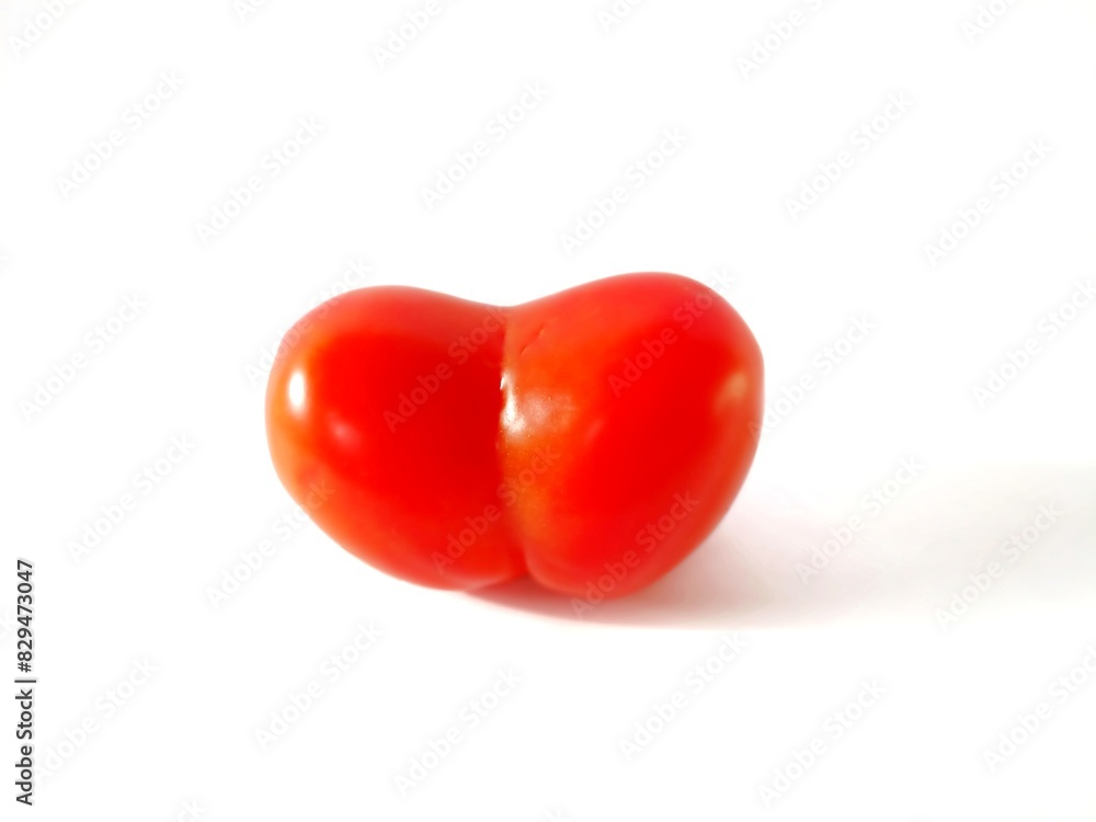 Heart-shaped tomatoes on a white background Heart-shaped tomatoes on a white background