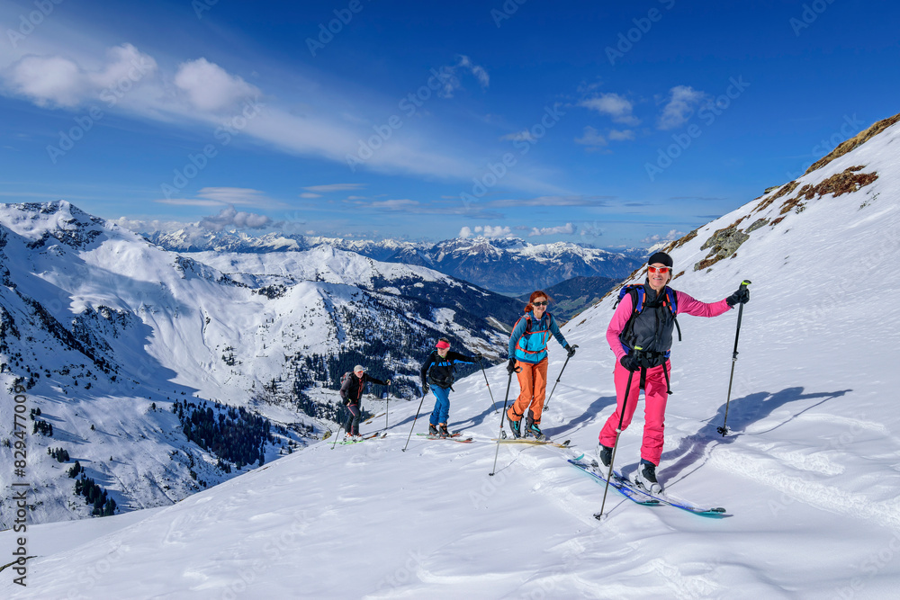 Women and men back country skiing at Gressenstein on sunny day, Inneralpbach, Kitzbuehel Alps, Tyrol, Austria Women and men back country skiing at Gressenstein on sunny day, Inneralpbach, Kitzbuehel Alps, Tyrol, Austria