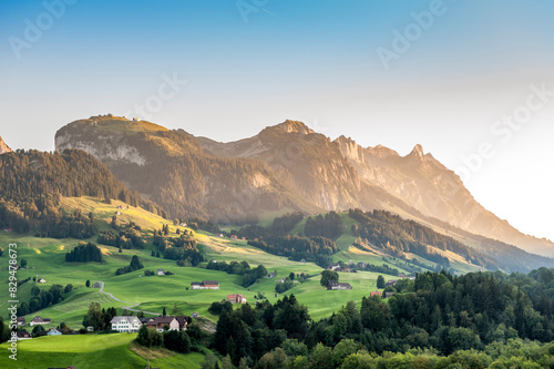 Switzerland,AppenzellInnerrhoden, Village inAppenzellAlps with Alpstein in background photo