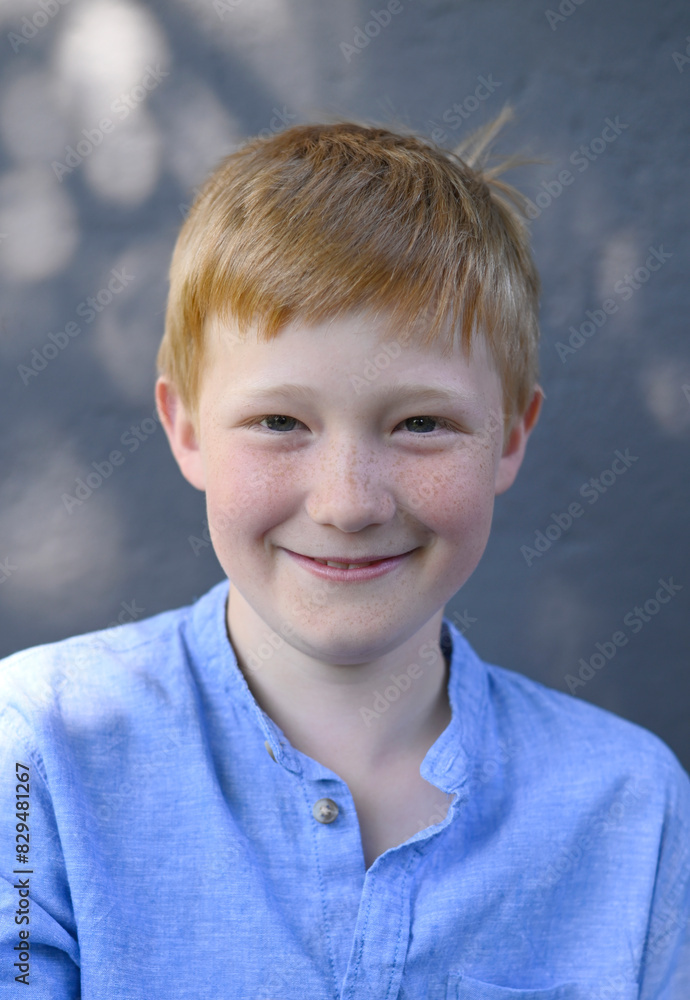 Smiling redhead boy in blue shirt Smiling redhead boy in blue shirt