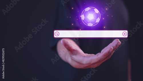 Male hand showing the internet search bar. SEO technology networking engine optimization internet with search bar. Searching browsing internet data information for Football live program concept.