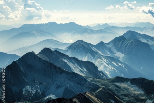 A mountain range stretching into the distance, representing the aspirational goals and lofty ambitions that effective leadership aims to achieve. photo
