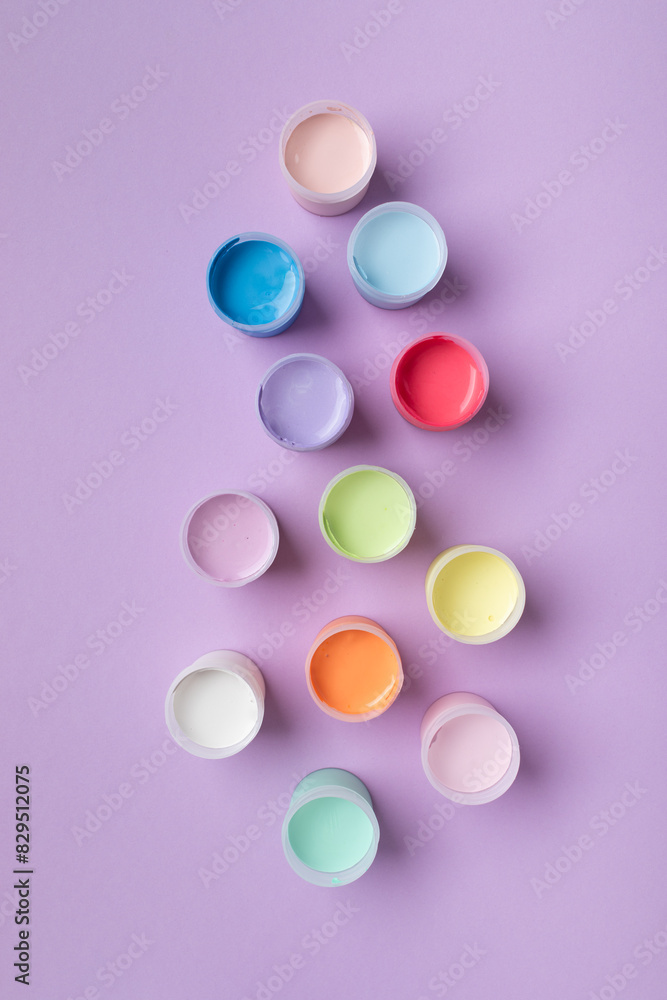 Pastel colors gouache in jars on table top view. Creative hobby painting concept. Pastel colors gouache in jars on table top view. Creative hobby painting concept.