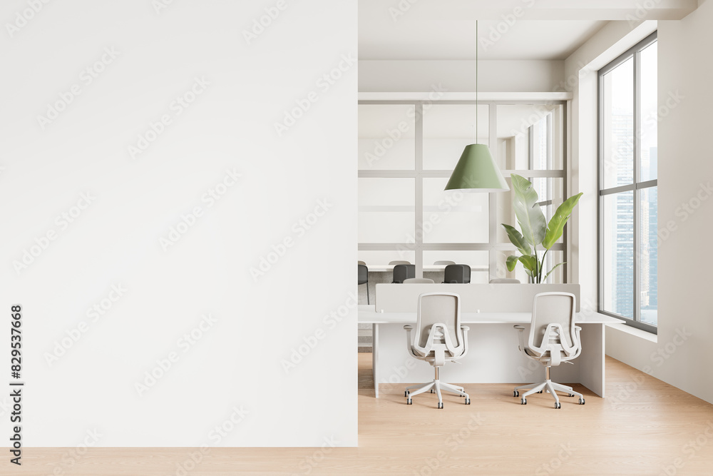 Modern office interior with white desks, chairs, green pendant lamp, and large windows, empty white wall on left, minimalistic design concept.  3D Rendering