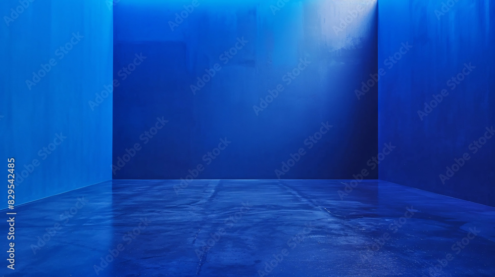 a blue room with a light shining on the wall