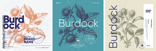 A set of three botanical product labels depicting the burdock plant, each executed in an engraving style with detailed illustrations, presented in blue and beige tones. © Molibdenis-Studio