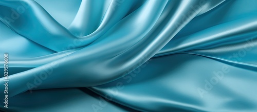 texture background pattern cyan blue silk fabric This very lightweight artificial silk fabric has a pleasant sheen Perfect for adding elegance to your internet decor projects. Copy space image