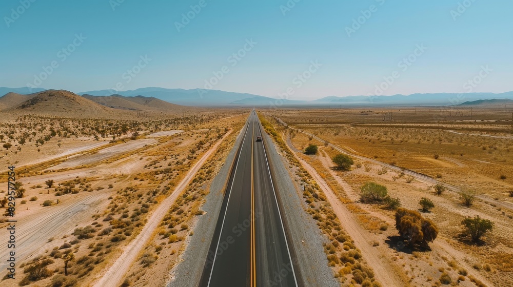 Breathtaking aerial view of desert road trip landscape. Dramatic aerial perspective showcasing vast desert scenery. Breathtaking aerial view of desert road trip landscape. Dramatic aerial perspective showcasing vast desert scenery.