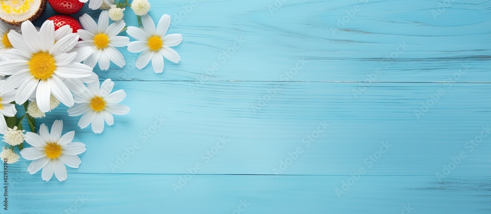 Obraz premium A summer themed travel accessory item displayed on a blue wooden background creating a holiday vacation concept with copy space image