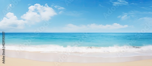 A serene beach scene with a tranquil ocean under a clear sunny sky ideal for a copy space image photo