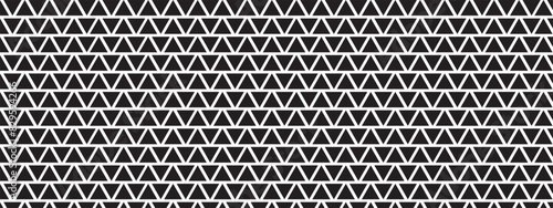 Perforated or corrugated surface with triangular holes. Repeating black triangles on white background. Pegboard, radiator or speaker grid texture. Abstract mosaic pattern. Vector graphic illustration