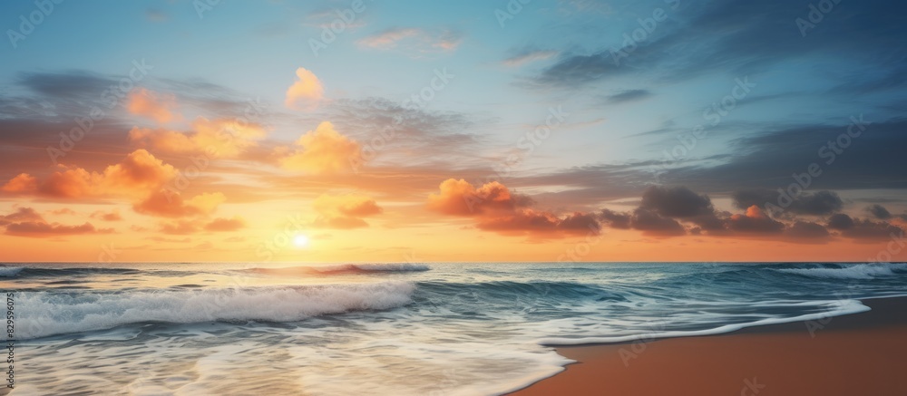 Fototapeta premium A sunrise captured with a scenic beach background in a photograph showing a tranquil copy space image