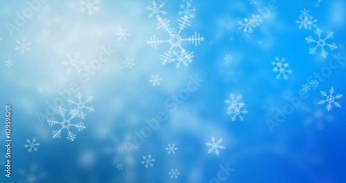 Snowflakes Particles Falling Christmas background, small snowflakes particles falling on a blue background. Lightray effect. photo