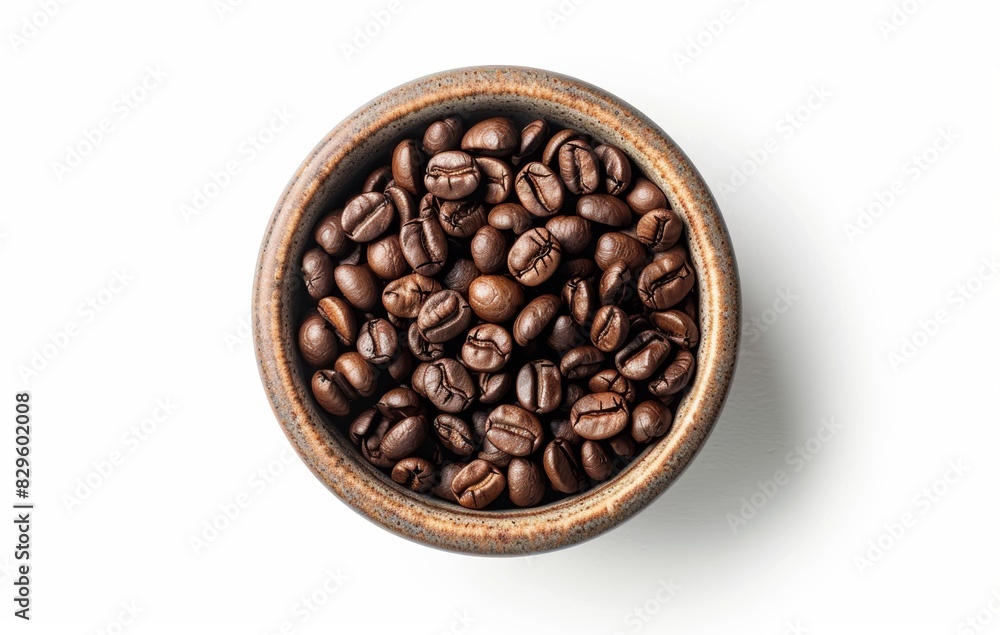 Fototapeta premium Top View of Freshly Roasted Coffee Beans in a Rustic Ceramic Bowl Isolated on White Background