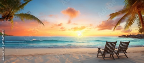 Enjoy a serene beach scene at sunrise or sunset providing the perfect setting to relax in a warm paradise complete with a stunning copy space image