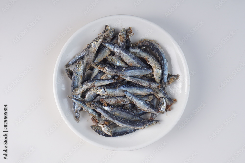 salted anchovies on a white background with studio lighting, in Indonesia is called salted anchovies on a white background with studio lighting, in Indonesia is called