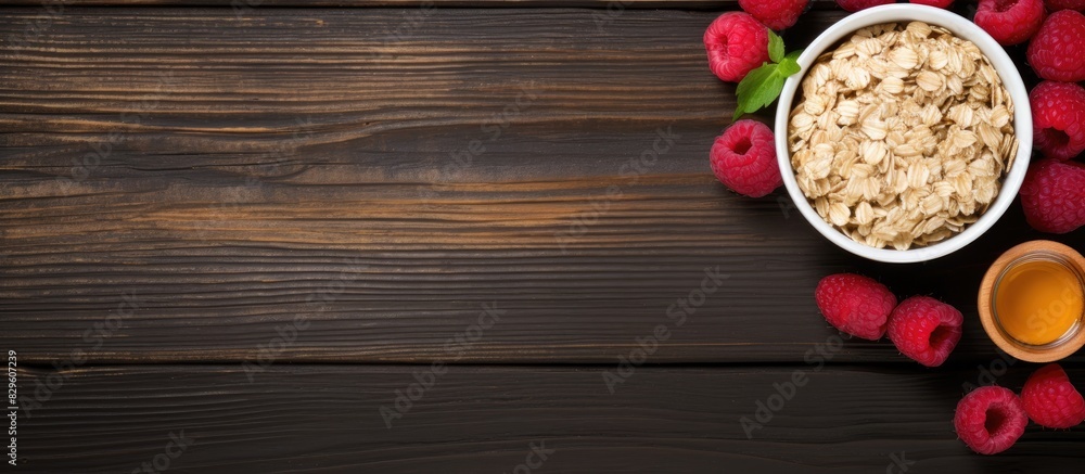Top view horizontal image of oatmeal with raspberries and honey with copy space image Top view horizontal image of oatmeal with raspberries and honey with copy space image