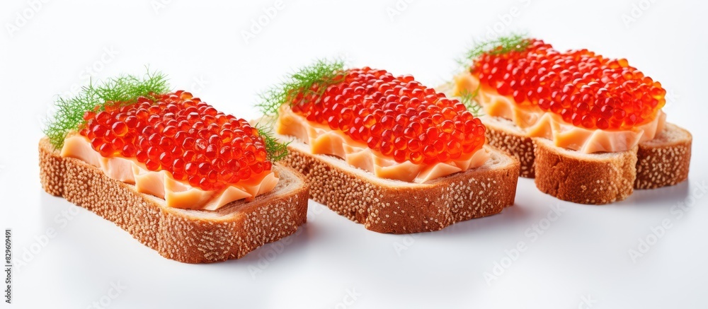 Two sandwiches with red caviar set isolated on a white background. Copy space image. Place for adding text and design Two sandwiches with red caviar set isolated on a white background. Copy space image. Place for adding text and design