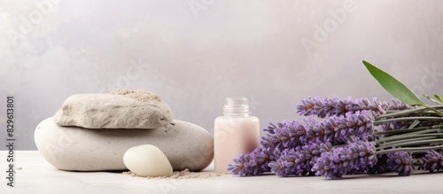 Composition with cosmetic products pumice stone and lavender flowers on light background. Copy space image. Place for adding text and design photo