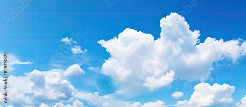 Beautiful sky background featuring a blue sky with white clouds ideal for a copy space image