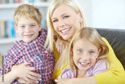 Portrait, mother and children on sofa with embrace, bonding and love in living room for playful family in home. Relax, mom and kids on couch for happy weekend together with fun, smile and hugging