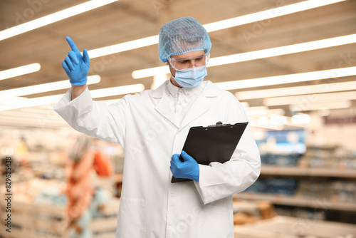 Food quality control specialist examining products in supermarket