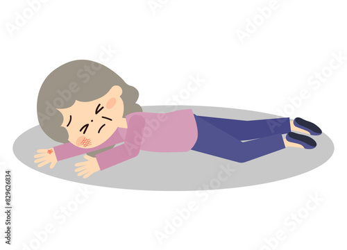 怪我をして地面に倒れているシニア女性