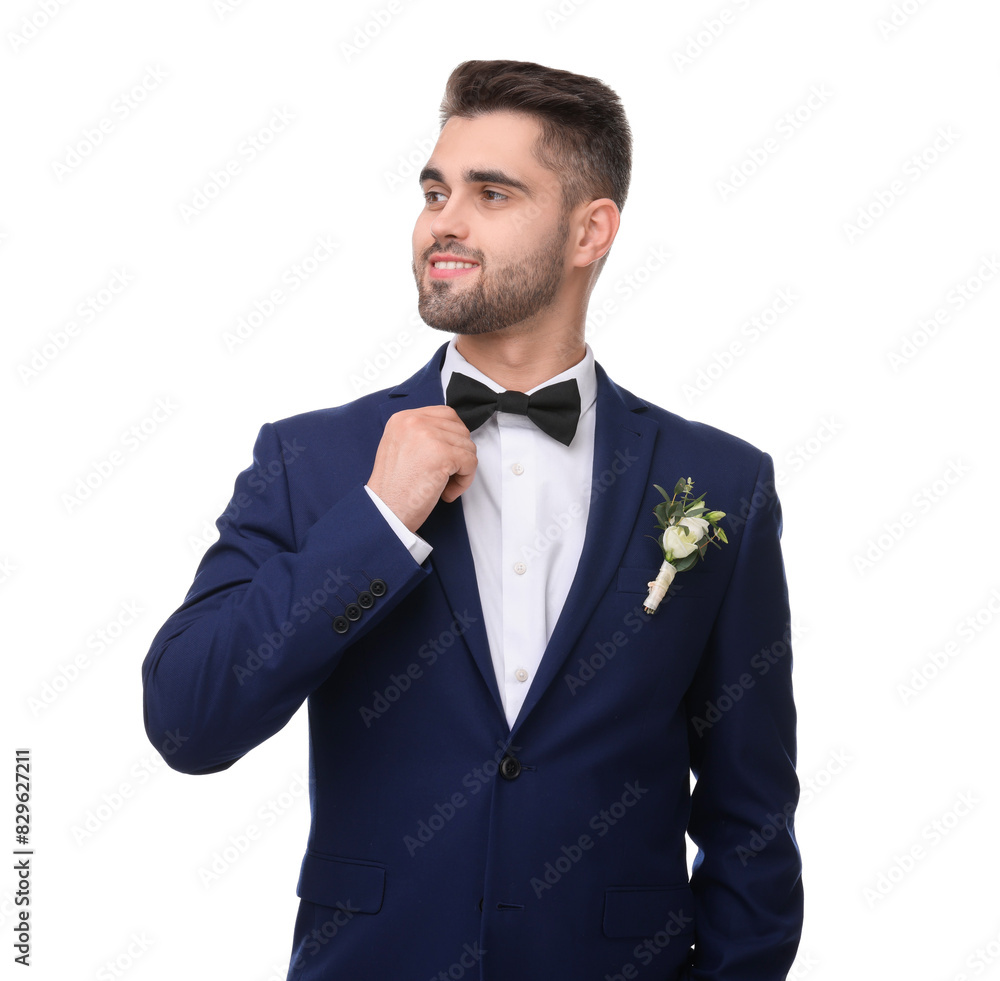 Handsome young groom with boutonniere on white background. Wedding accessory Handsome young groom with boutonniere on white background. Wedding accessory