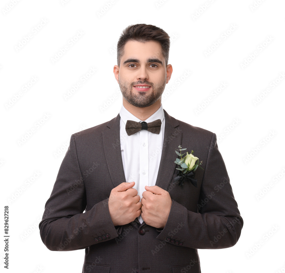 Handsome young groom with boutonniere on white background. Wedding accessory Handsome young groom with boutonniere on white background. Wedding accessory