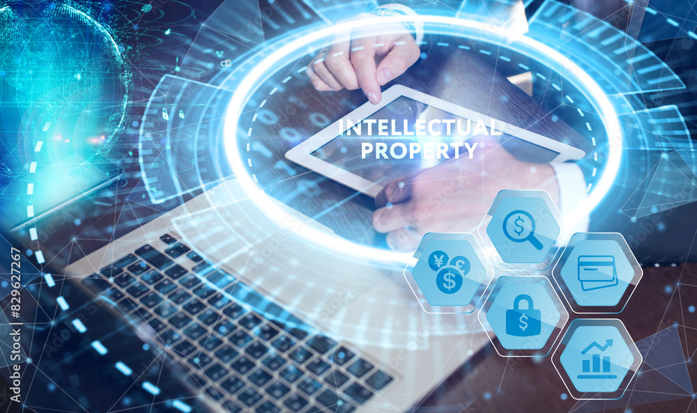 Business, technology, internet and network concept. Virtual screen of the future and sees the inscription: Intellectual property. Business, technology, internet and network concept. Virtual screen of the future and sees the inscription: Intellectual property.