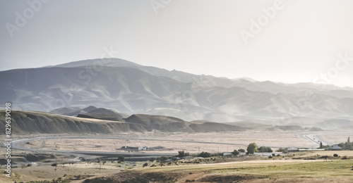 Panorama of mountains  hills and fields in the mountains of Tajikistan  spacious landscape for background on a sunny summer day