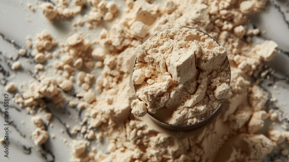Close-up of protein powder and scoop Focusing on using it for exercise. Close-up of protein powder and scoop Focusing on using it for exercise.