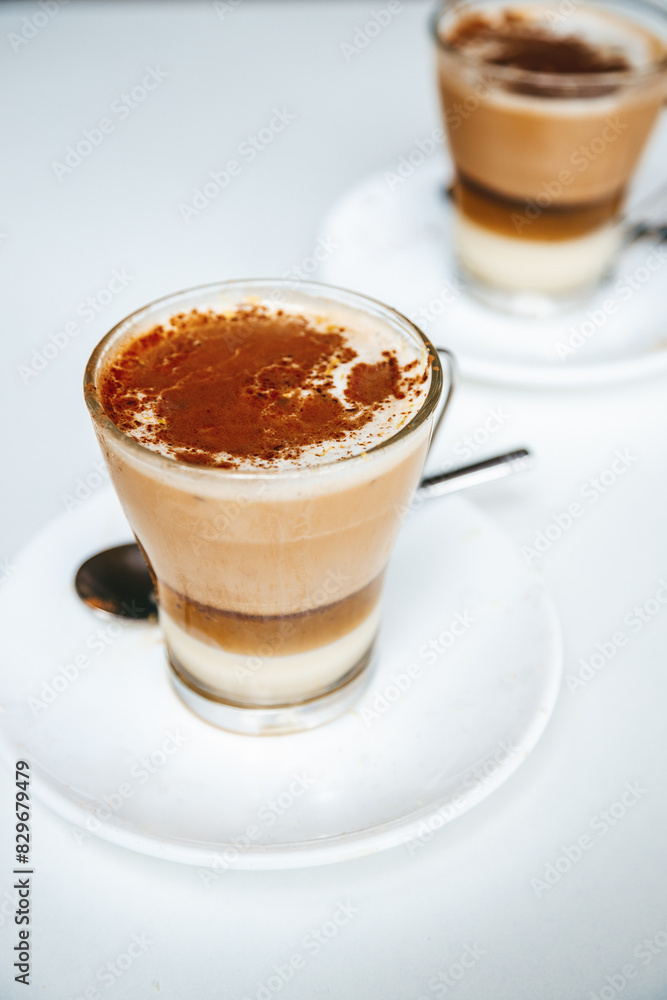 Barraquito - a popular layered coffee drink from Tenerife, featuring espresso, condensed milk, frothed milk, and a touch of Licor 43 Barraquito - a popular layered coffee drink from Tenerife, featuring espresso, condensed milk, frothed milk, and a touch of Licor 43