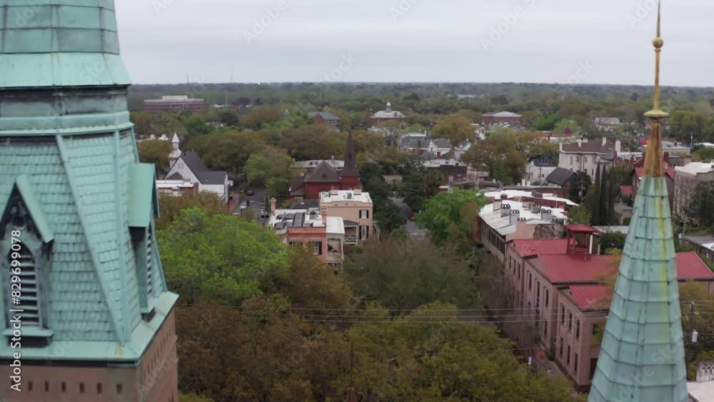 Aerial low shot flying between the Congregation Mickve Israel Temple spires in downtown Savannah, Georgia. 4K Aerial low shot flying between the Congregation Mickve Israel Temple spires in downtown Savannah, Georgia. 4K