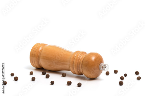 Wooden pepper mill isolated on white background.