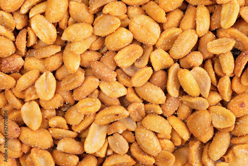 Salted peanuts close-up, top view. Lots of roasted peanuts