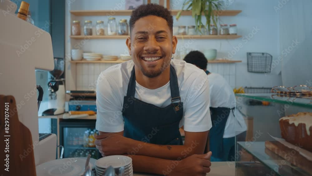 Cinematic image of employees working in a nordic styled cafe. Cinematic image of employees working in a nordic styled cafe.