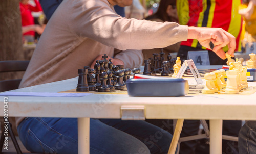 a man is participating in a chess tournament