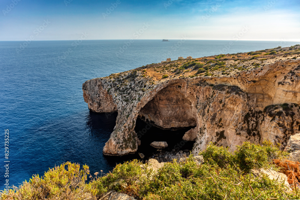Fototapeta premium The Blue Grotto caverns, rock formation on the Mediterranean sea. Natural arch window in rock. Malta