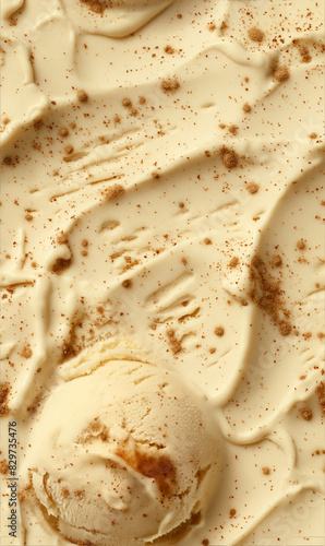 cinnamon ice cream surface close-up shot, a closeup of the cinnamon ice cream texture, featuring its creamy base with a light brown color and specks of cinnamon