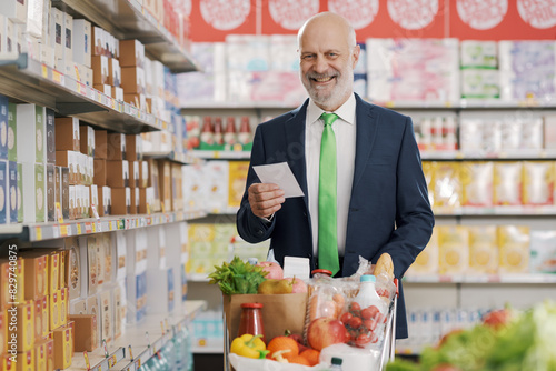 Confident businessman at the grocery store photo