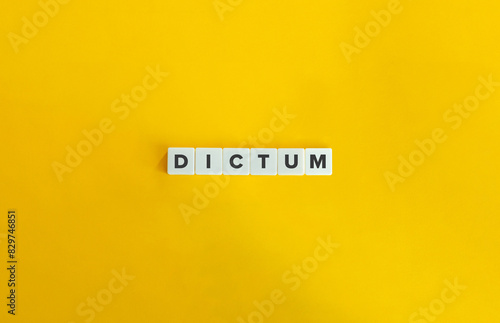 Dictum Word. Text on Block Letter Tiles on Flat Background. Minimalist Aesthetics. photo