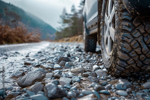 Car tire on a stony road, close up view with copy space, photography  photo