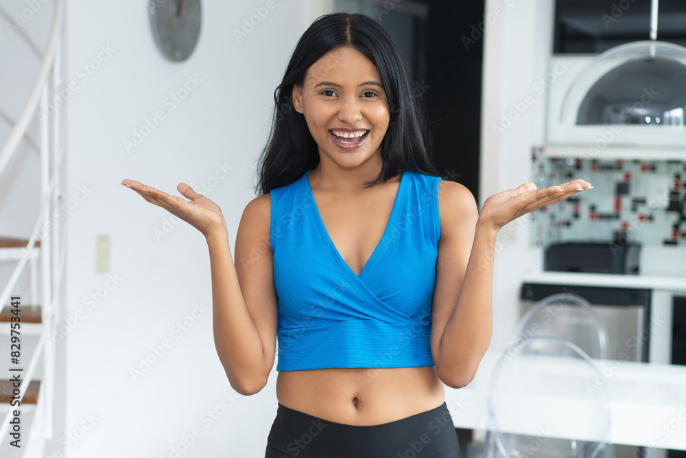Laughing mexican young woman ready for workout Laughing mexican young woman ready for workout