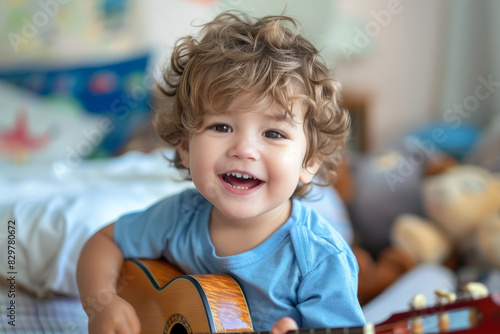 Young happy boy learning music playing guitar ukulele singing