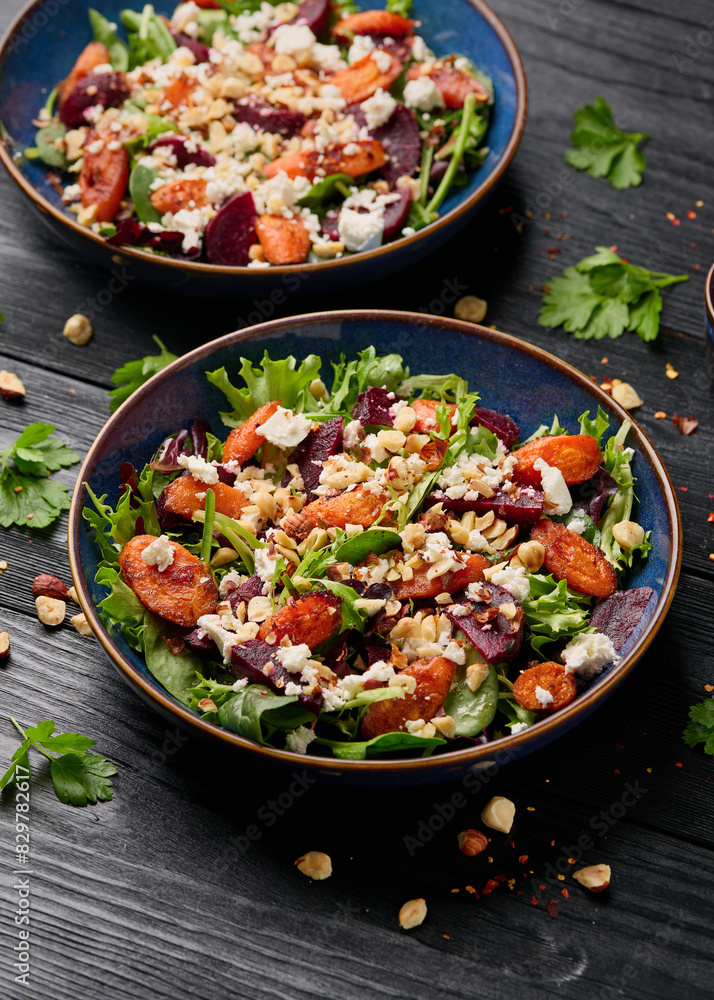 Warm baked carrots and beetroot salad with feta cheese and roasted hazelnuts Warm baked carrots and beetroot salad with feta cheese and roasted hazelnuts