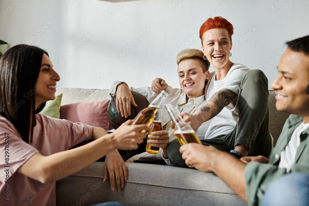 Diverse friends and a loving lesbian couple lounging on a couch. Diverse friends and a loving lesbian couple lounging on a couch.