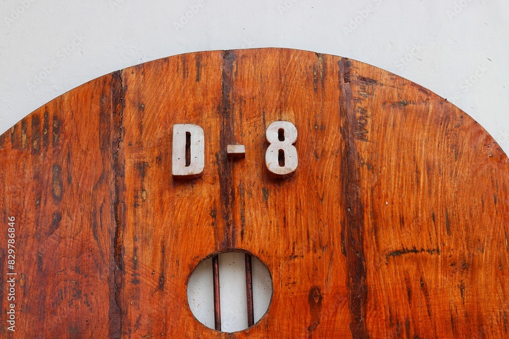 House number six on brown wooden door House number six on brown wooden door